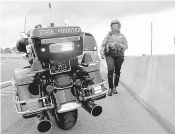  ?? CARLINE JEAN/SUN SENTINEL ?? At 5 feet 1 inch and weighing 135 pounds, Chantale Jones had to pick up her 1,100-pound bike to be part of the unit.