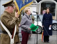  ??  ?? Kay Doyle, whose late father Thomas Colfer fought in the Great War, recites a poem she wrote herself for the commemorat­ion.