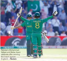  ?? — Reuters ?? Pakistan’s Mohammad Hafeez and Babar Azam celebrate after winning the match against England.