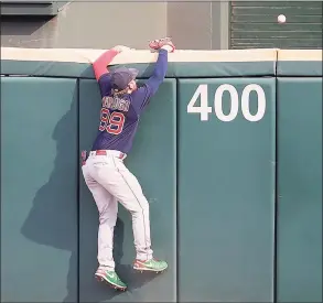  ?? Jonathan Daniel / Getty Images ?? Red Sox outfielder Alex Verdugo climbs the wall as a ball hit by Chicago’s Leury Garcia of sails over the center-field wall in the ninth inning on Sunday in Chicago. The White Sox defeated the Red Sox 2-1.