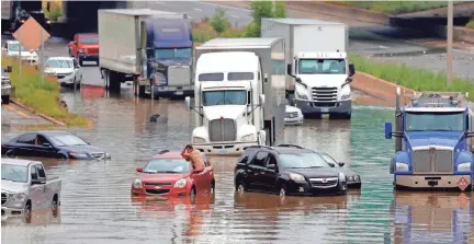  ?? FREE PRESS/USA TODAY NETWORK ERIC SEALS/DETROIT ?? Heavy rains in Metro Detroit caused massive flooding in homes, streets and freeways on June 26.