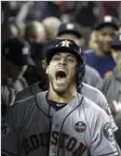  ?? AP PHOTO/ DAVID J. PHILLIP ?? Houston Astros’ George Springer celebrates after hitting a two-run home run during the 11th inning of Game 2 of baseball’s World Series against the Los Angeles Dodgers on Wednesday in Los Angeles.