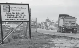  ?? William Luther photos / Staff photograph­er ?? Trucks wait to enter Sprint Energy Services’ Karnes County oil and gas waste treatment facility and landfill. Pawnee residents are fighting a similar proposal.