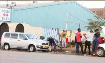  ??  ?? Some businesses that operate along Samora Machel Avenue in Harare have written to council complainin­g over illegal car washers operating in front of their shops and reportedly vandalisin­g council pipes to get water. Here, one car is being washed on the...