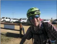  ?? DAN ELLIOTT — THE ASSOCIATED PRESS ?? Jon Simon takes a break after about a 2-hour mountain bike ride at Rocky Flats National Wildlife Refuge outside Denver on Saturday, the first day the refuge was open to the public.