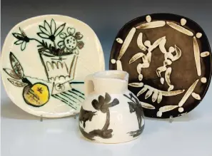  ?? ?? Picasso Madoura editions ceramics ‘Bunch with Apple’, ‘Two Dancers’ and ‘Bull and Picador’.