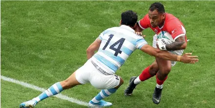  ?? GETTY IMAGES ?? Tonga’s Telusa Veainu takes on Matias Moroni yesterday.