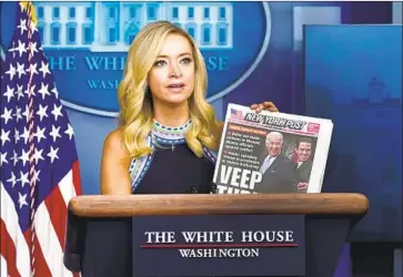  ?? WHITE HOUSE Patrick Semansky Associated Press ?? Press Secretary Kayleigh McEnany holds the New York Post with the Hunter Biden report. Facebook’s and Twitter’s actions drew accusation­s of bias from President Trump and other GOP leaders.