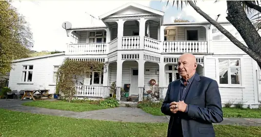  ?? MARTIN DE RUYTER/STUFF ?? Ian Keightley of Sotheby’s outside the former staff quarters at the Wainui House property. Tenders close on June 15.