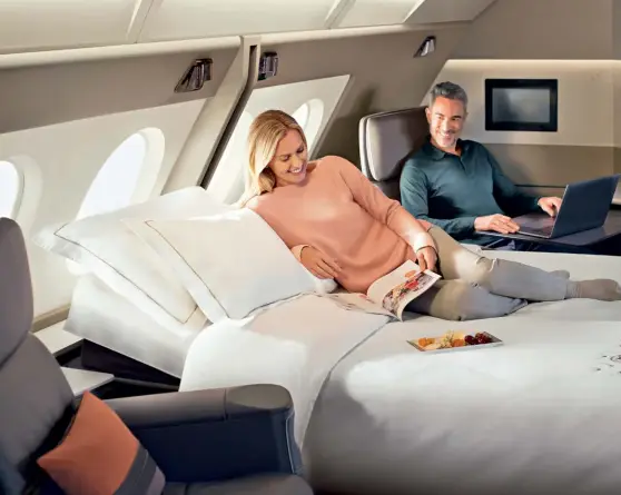  ?? ?? TECH-TONIC LUXE MATRIX
Singapore Airlines offers a class above First called ‘Suites’ that includes a double bed (Above); Qatar Airways’ QSuite allows four passengers to create a fourseated joint suite (Far right)