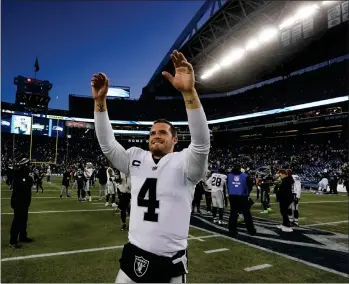  ?? AP PHOTO BY GREGORY BULL ?? Las Vegas Raiders quarterbac­k Derek Carr celebrates after an overtime win over the Seattle Seahawks during an NFL football game Sunday, Nov. 27, 2022, in Seattle.