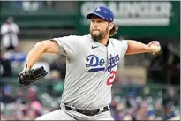  ?? ?? Los Angeles Dodgers starting pitcher Clayton Kershaw throws against the Chicago Cubs on Sunday.