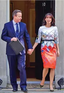  ??  ?? JUNE 24
Defeated and dejected, David Cameron is joined by wife Samantha outside No 10 as he resigns