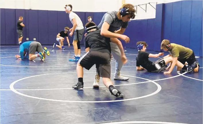  ?? TOM HOUSENICK/MORNING CALL PHOTOS ?? Coached by Kurt Handel, Quakertown wrestlers go through a drill at a recent practice.