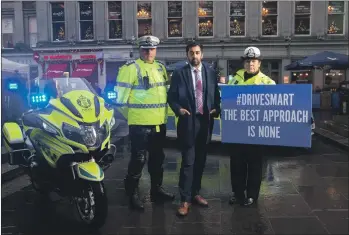  ??  ?? Chief Inspector Darren Faulds, Police Scotland’s road policing west area commander; Justice Secretary Humza Yousaf and Superinten­dent Louise Blakelock, Police Scotland’s deputy head of road policing.