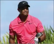  ?? DANTE CARRER — THE ASSOCIATED PRESS ?? Tiger Woods gestures watches his shot from the third tee during the final round of the Hero World Challenge golf tournament at Albany Golf Club in Nassau, Bahamas, Sunday.