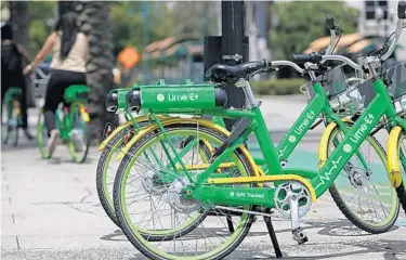  ?? RICARDO RAMIREZ BUXEDA/ORLANDO SENTINEL ?? Lime Bikes may soon be leaving Orlando as the company eyes bringing its scooters to the city instead.