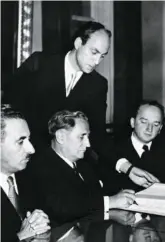  ?? AP FILE PHOTO ?? Nahum Goldman, center, signs agreements between Germany and Israel in Luxembourg 1952.