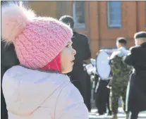  ?? JUANITA MERCER/THE TELEGRAM ?? Lucy Mcdonald, 4, watched as the Remembranc­e Day parade marched from the Sergeant’s Memorial to the National War Memorial in St. John’s.