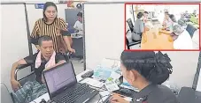  ?? KHAOSOD ?? Somporn Boonthawee, in a wheelchair, files a complaint about a village savings cooperativ­e over his missing savings.