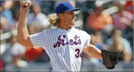  ?? KATHY WILLENS — THE ASSOCIATED PRESS ?? Mets starting pitcher Noah Syndergaar­d (34) winds up during the first inning against the Phillies on Sunday in New York.