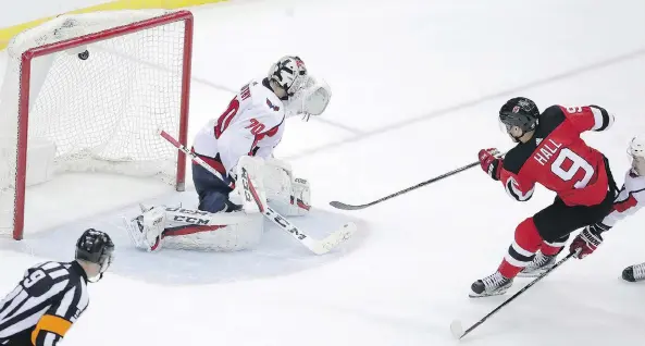  ?? JULIO CORTEZ/THE ASSOCIATED PRESS ?? New Jersey Devils left winger Taylor Hall scores on Washington Capitals goaltender Braden Holtby for the overtime winner Jan. 18 in Newark, N.J.