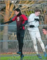  ?? SARAH GORDON/THE DAY ?? Fitch’s Aidan Mclean (9) and Pomperaug’s Patrick Weitekamp (2) fight for a ball at the goal during Wednesday’s CIAC Class L boys’ soccer game at Poquonnock Plains Park.