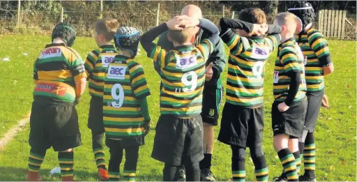  ??  ?? A half-time pep talk for Littleboro­ugh’s under 9s in their clash against Manchester at the weekend