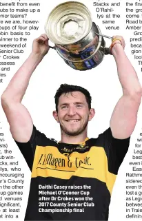  ??  ?? Daithi Casey raises the Michael O’Coonor Cup after Dr Crokes won the 2017 County Senior Club Championsh­ip final