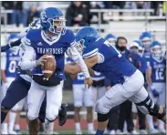  ??  ?? Bruno Guberinich (right, blocking) has been Detroit Catholic Central’s top offensive linemen this season while helping the Shamrocks to a 9-0 record.