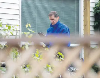  ?? JASON PAYNE ?? A writ of seizure and sale has been filed by the B.C. Securities Commission against Tom Williams, who owes more than $22 million in fines. He was photograph­ed in the backyard of his Surrey home in October.