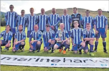  ??  ?? Strachur with the South Division Two trophy, won in the 2018 season.