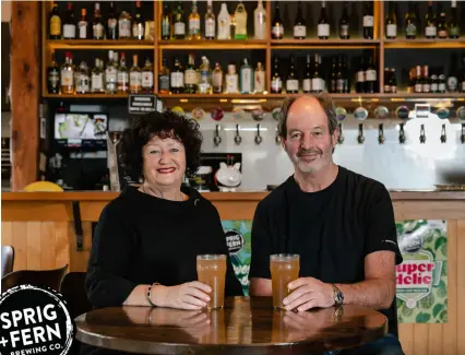  ?? ?? Owners Susan Bloomfield and Peter Fry enjoying a pint at the Sprig + Fern Mapua.