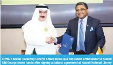  ?? — Photos by Yasser Al-Zayyat ?? KUWAIT: NCCAL Secretary General Kamel Abdul Jalil and Indian Ambassador to Kuwait Sibi George shake hands after signing a cultural agreement at Kuwait National Library yesterday.