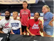  ?? DAVID JABLONSKI / STAFF ?? The Red Scare’s Scoochie Smith and Joe Thomasson pose with fans attending The Basketball Tournament press conference on Wednesday at UD Arena.