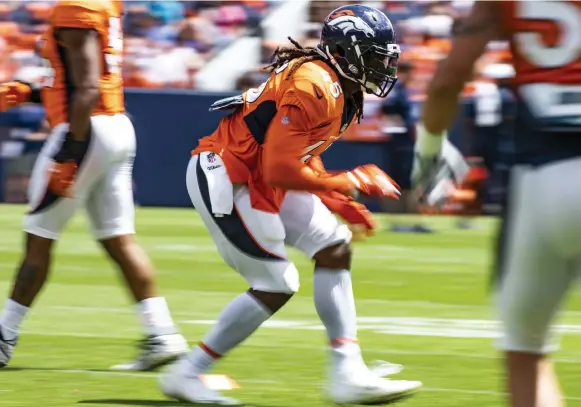  ?? Michael Ciaglo, Special to The Denver Post ?? Broncos inside linebacker Alexander Johnson runs through a drill during training camp on last summer.