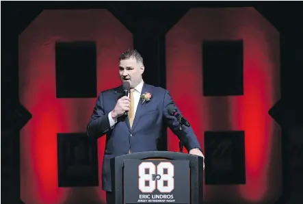  ?? PHOTOS: PATRICK SMITH/GETTY IMAGES ?? Eric Lindros speaks to the crowd Thursday at the Wells Fargo Center in Philadelph­ia, where the Flyers retired the former captain’s No. 88 jersey before their game against the Toronto Maple Leafs. The six-foot-four centre redefined the power forward...