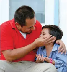  ??  ?? Walter Armando Jimenez Melendez arrives with his son Jeremy at La Posada Providenci­a shelter in San Benito, Texas on Tuesday. — Reuters