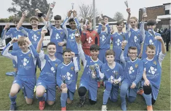  ?? Spalding United Blue Under13s celebrate their Legaue Cup final win. Their team was Zeren Akyuz, Billy Andrews, Connor Beeken, Tyriece Buffong, Samir Cookson, Ben Greenacre, Kiaran Grove, Derrie Maxwell, Alexandru-Dorin Metiu, Keane Slayven, Liam Smith, Jo ??