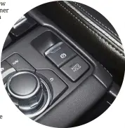  ??  ?? The new CX-3’s electronic parking brake is easier to use compared with the previous manual lever type.