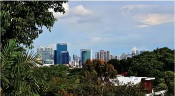  ??  ?? Beyond the greenery is the view of the city skyline