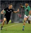  ??  ?? All Blacks right wing Israel Dagg tries to beat Ireland’s Simon Zebo during the test in Dublin last weekend.