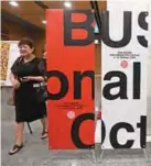  ??  ?? In this file photo a woman walks past signboards for the Busan Internatio­nal Film Festival (BIFF) after a press conference on the festival overview in Seoul. — AFP