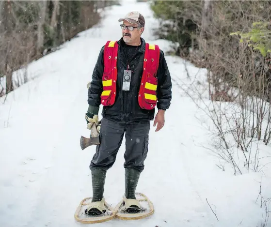  ?? TYLER ANDERSON / NATIONAL POST ?? Prospector Glenn McBride walks along a mining trail near Cobalt, Ont. For many years, he has made living as a “staker” heading out into the bush and hammering pieces of wood into the ground and claiming the mining rights for himself and other interests.