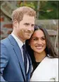  ?? IMAGES CHRIS JACKSON / GETTY ?? Prince Harry and actress Meghan Markle during an official photocall to announce their engagement at the Sunken Gardens at Kensington Palace on Nov. 27 in London.