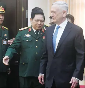  ??  ?? US Secretary of Defense James Mattis, right, and Vietnam's Defense Minister Ngo Xuan Lich on Thursday discussed the planned US aircraft carrier visit to Vietnam in March at the Ministry of Defence in Hanoi. (AFP)