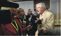  ?? SEAN KILPATRICK/THE CANADIAN PRESS FILES ?? A Conservati­ve supporter heckles reporters in Toronto who were asking about the Duffy affair.