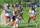  ?? SAM STEWART - DIGITAL FIRST MEDIA ?? Spring-Ford’s Michaela Haney runs into Boyertown’s Hannah Wentzel near the crease during the second half.