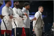  ?? AARON ONTIVEROZ — THE DENVER POST ?? Nikola Jokic, right, of the Nuggets stands with (from right) Luka Doncic of the Mavericks, Lebron James of the Lakers and Kevin Durant of the Suns as they take orders on the presentati­on of pregame activities during the NBA All-star game at Gainbridge Fieldhouse in Indianapol­is on Sunday.