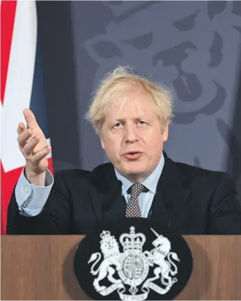  ?? Getty ?? UK Prime Minister Boris Johnson speaks to reporters in London after a trade deal was struck with the EU four-and-a-half years after the referendum vote to leave the bloc